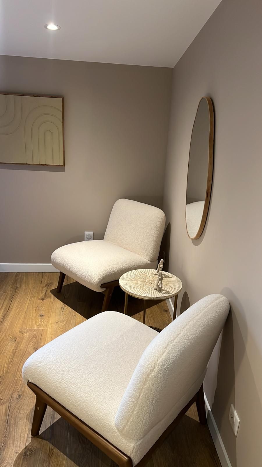 Reading corner — two boucle chairs & round mirror