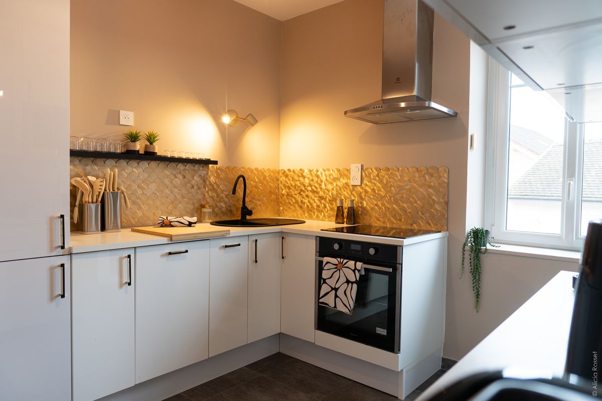 Kitchen — white cabinets & golden mosaic splashback
